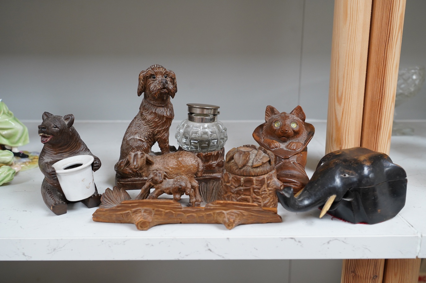 A collection of five carved wooden novelty animal inkwells, four black forest, tallest dog inkwell 15cm high. Condition - some small chips but fair